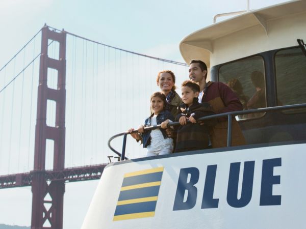 Blue and Gold Fleet ferry cruising past the Golden Gate Bridge